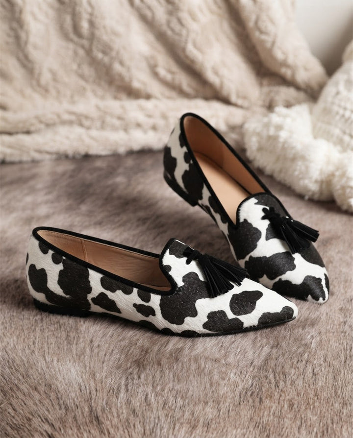 Ginevra Moccasin | Black and White Cow Print, Black Tassels