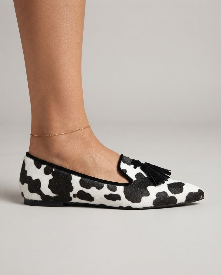 Ginevra Moccasin | Black and White Cow Print, Black Tassels