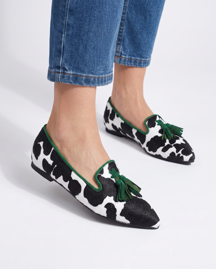 Ginevra Moccasin | Black and White Cow Print, Green Tassels