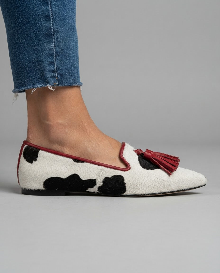 Ginevra Moccasin | Black and White Cow Print, Red Tassels