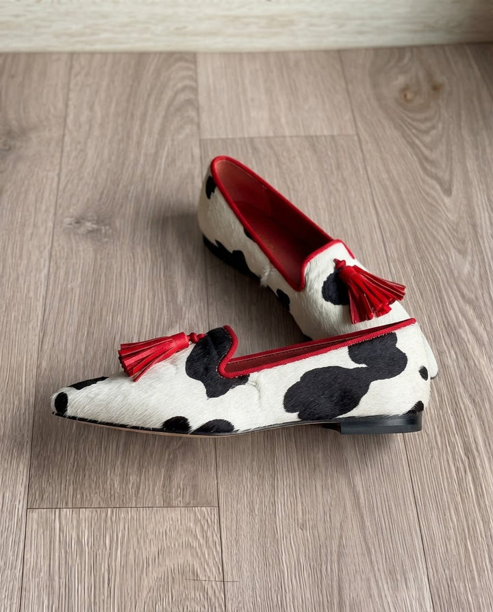Ginevra Moccasin | Black and White Cow Print, Red Tassels